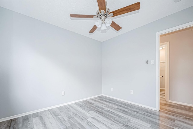 unfurnished room featuring light hardwood / wood-style flooring and ceiling fan