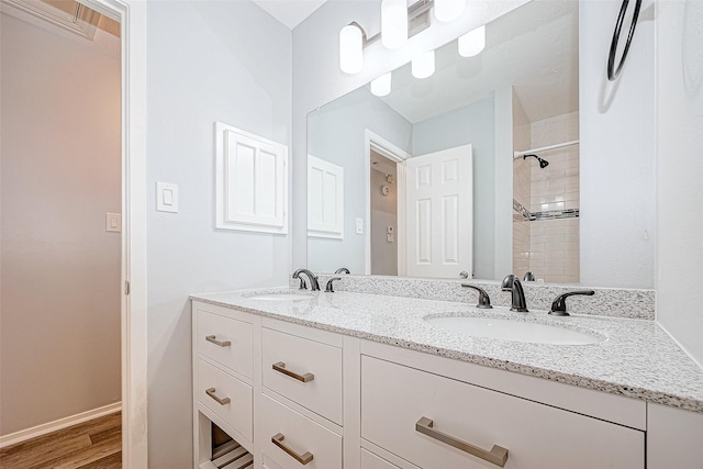 bathroom featuring vanity and wood-type flooring