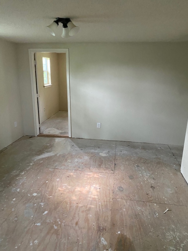 unfurnished room featuring a textured ceiling