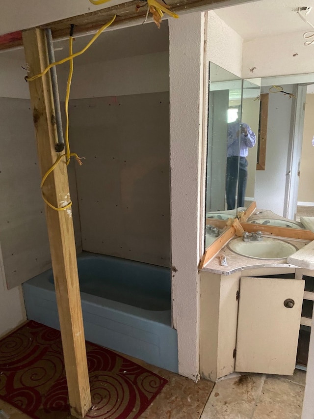 bathroom with shower / bathtub combination and vanity