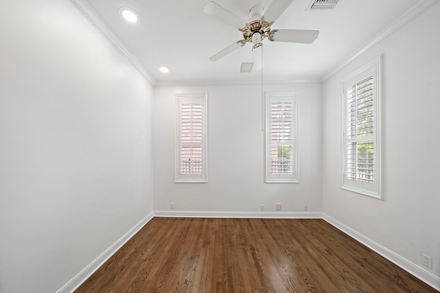 empty room with ornamental molding, dark wood-type flooring, and ceiling fan