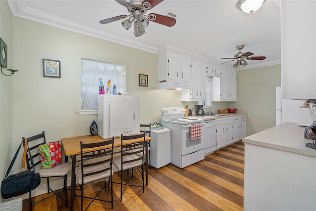 kitchen featuring washer / clothes dryer, ceiling fan, white appliances, and hardwood / wood-style floors