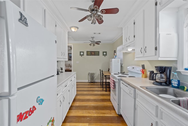 kitchen featuring ceiling fan, custom exhaust hood, white appliances, light wood-type flooring, and white cabinetry