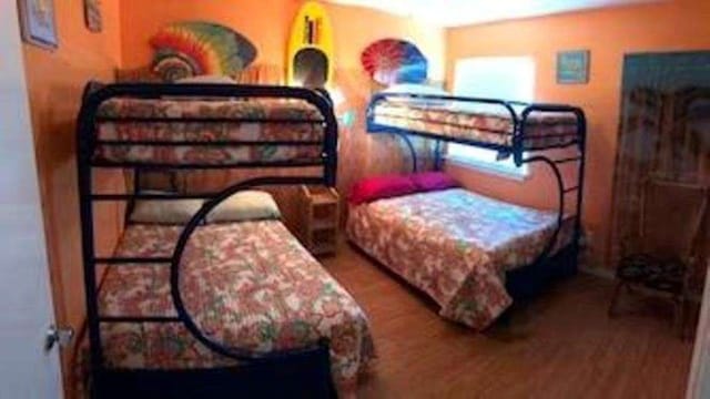 bedroom with wood-type flooring