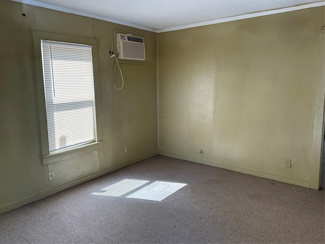 carpeted empty room featuring a wall unit AC