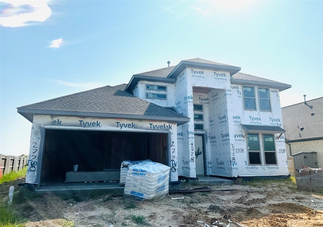 property in mid-construction with a garage