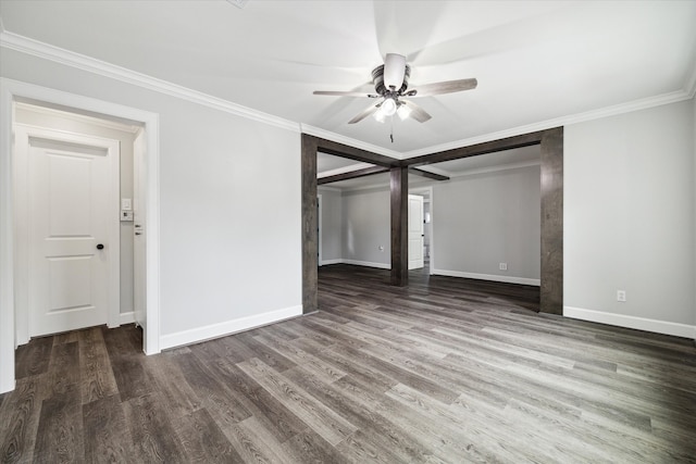 empty room featuring crown molding, ceiling fan, and dark hardwood / wood-style flooring