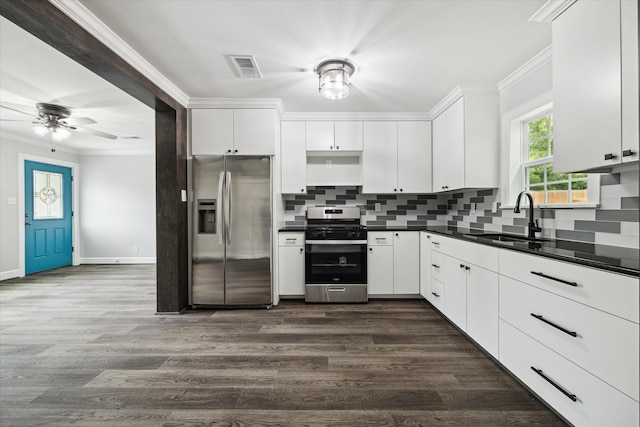 kitchen with white cabinetry, sink, ceiling fan, dark wood-type flooring, and appliances with stainless steel finishes