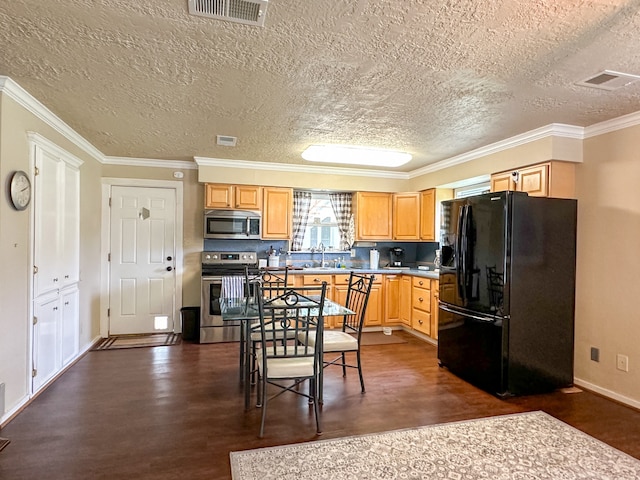 kitchen with ornamental molding, dark wood-type flooring, stainless steel appliances, and light brown cabinetry