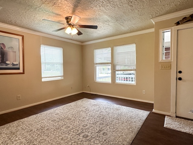 unfurnished room with crown molding, dark hardwood / wood-style floors, and ceiling fan