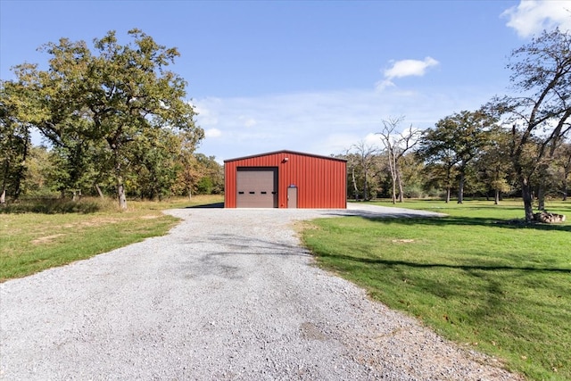 view of front of property with a garage and a front yard