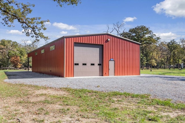 garage featuring a lawn