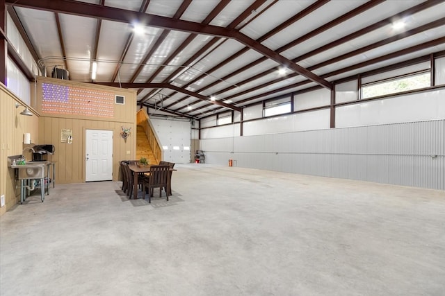 garage featuring wooden walls