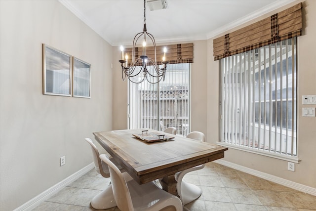 tiled dining area with a notable chandelier and crown molding