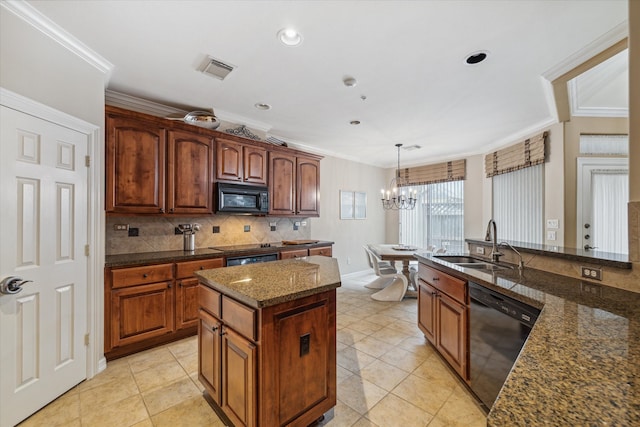 kitchen featuring a center island, sink, a notable chandelier, black appliances, and pendant lighting