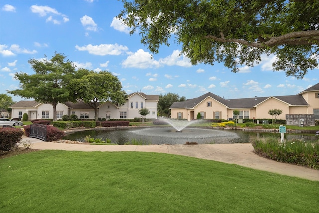 exterior space featuring a water view and a front yard