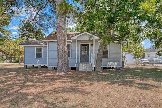 bungalow with a front lawn