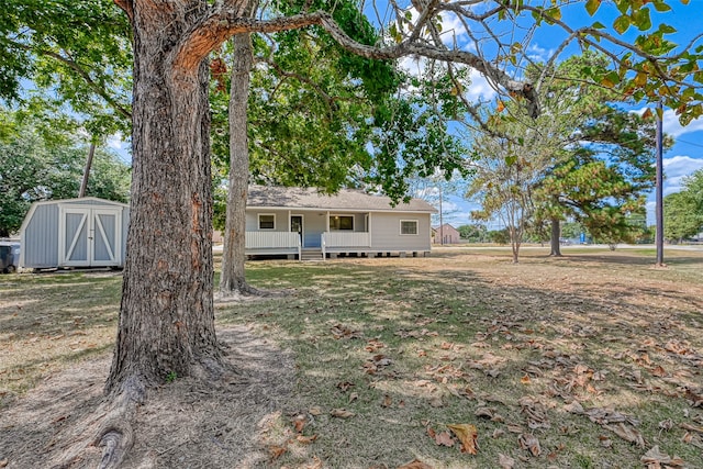 view of front of property featuring a wooden deck and a storage unit