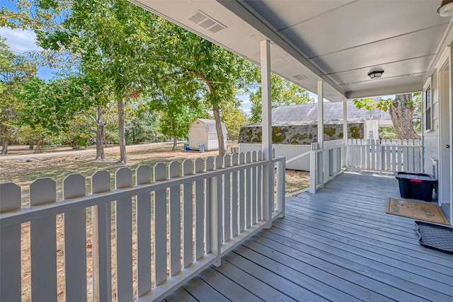 deck with a storage shed