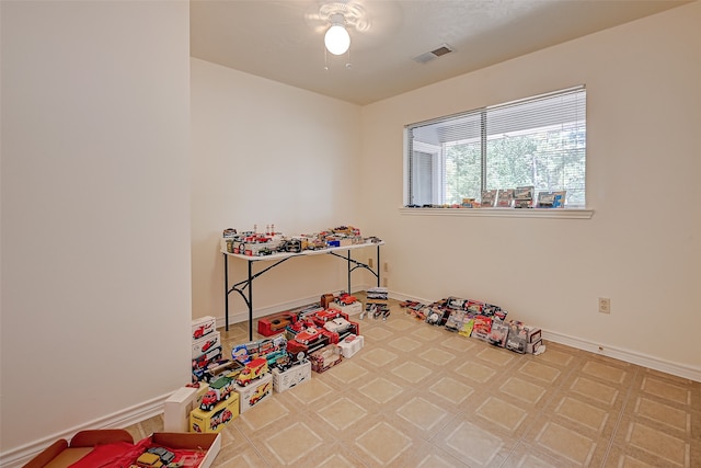 playroom featuring ceiling fan