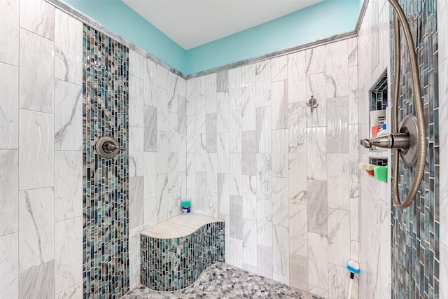 bathroom featuring tiled shower