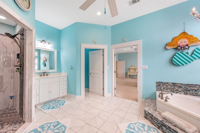 bathroom with visible vents, a tile shower, a ceiling fan, and vanity