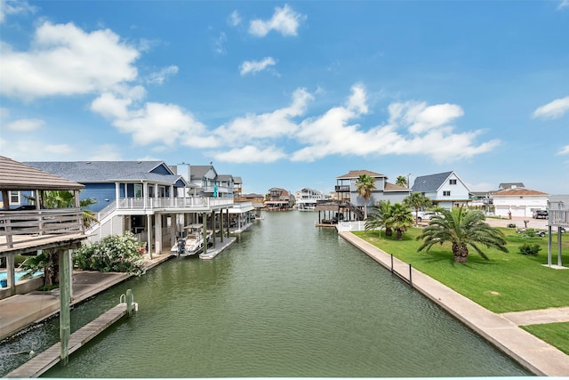 view of water feature featuring a dock and a residential view