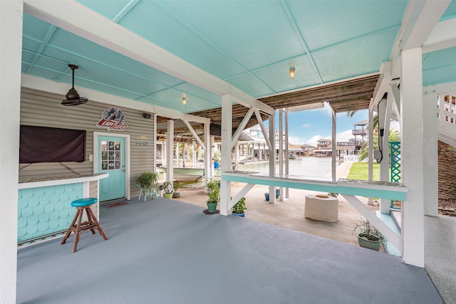 view of patio / terrace with a boat dock