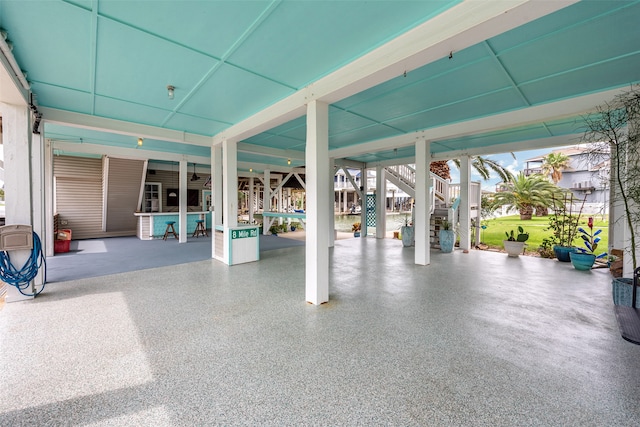 view of patio / terrace with a carport and stairway