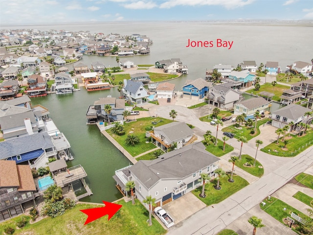 aerial view featuring a water view and a residential view