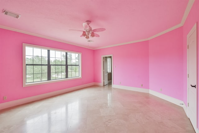 tiled spare room featuring ceiling fan and ornamental molding