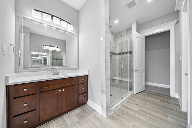 bathroom featuring vanity and walk in shower