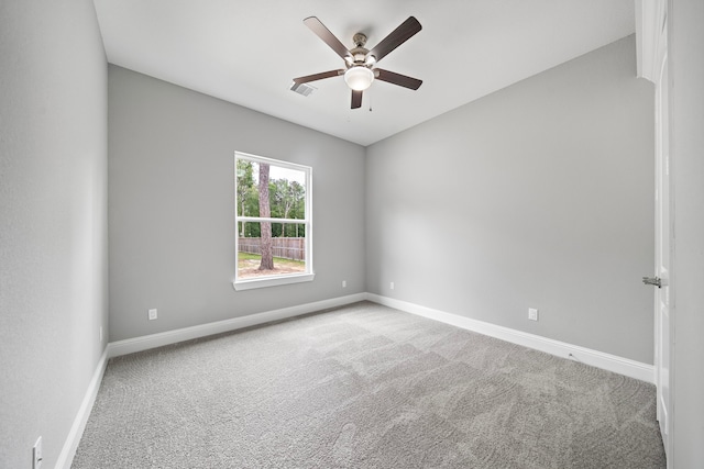 empty room with light carpet and ceiling fan