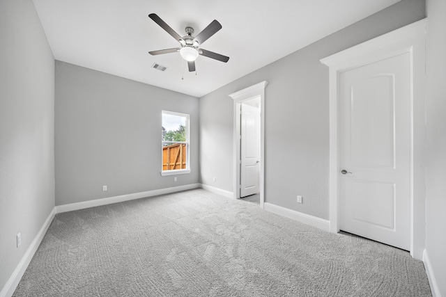 unfurnished bedroom with ceiling fan and light carpet