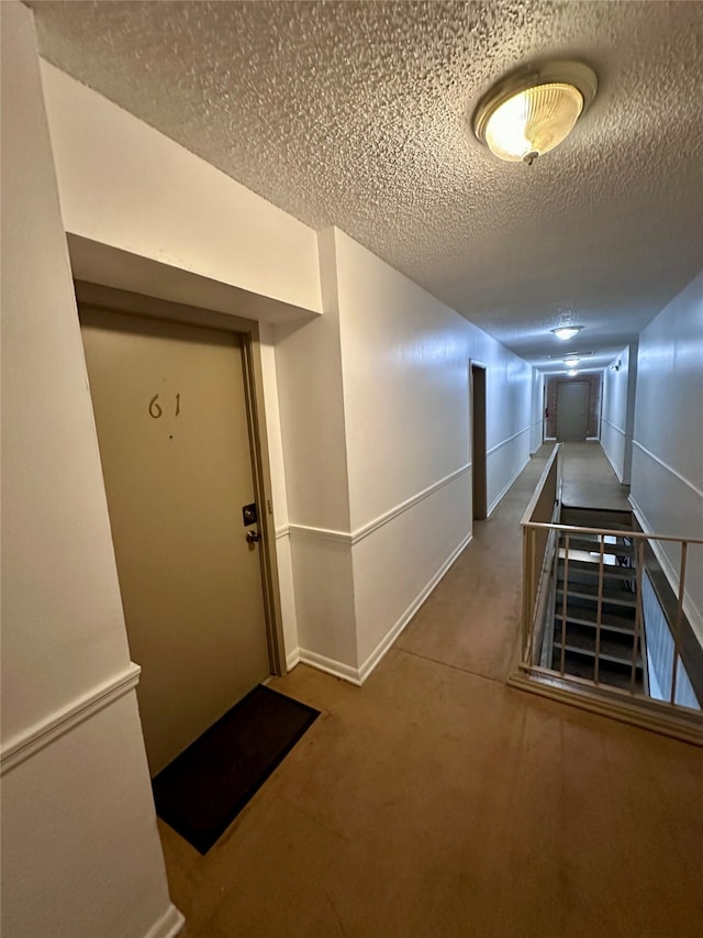 interior space featuring a textured ceiling