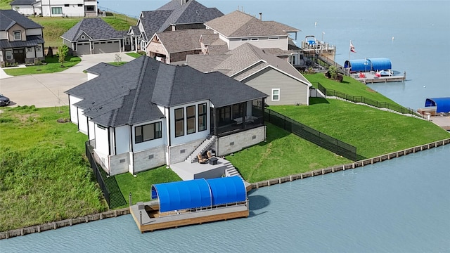 aerial view featuring a water view and a residential view