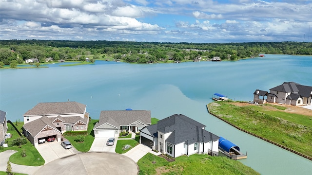 bird's eye view featuring a residential view and a water view