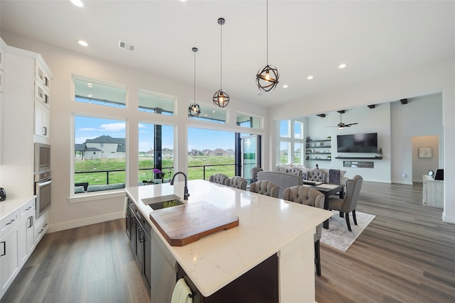 kitchen featuring visible vents, stainless steel appliances, a wealth of natural light, and open floor plan