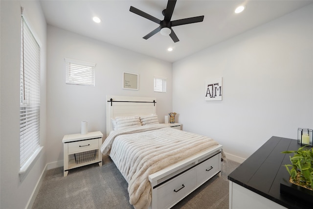 bedroom with recessed lighting, baseboards, and dark colored carpet