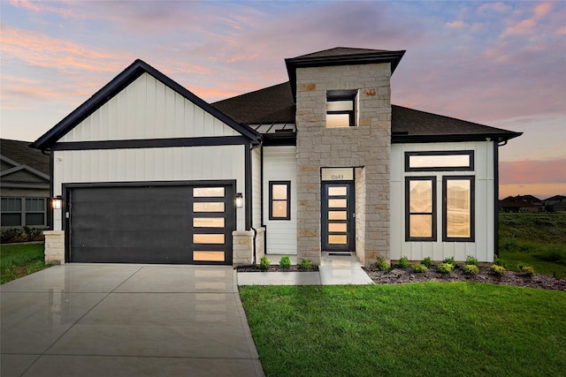 view of front of property featuring a shingled roof, concrete driveway, board and batten siding, and an attached garage