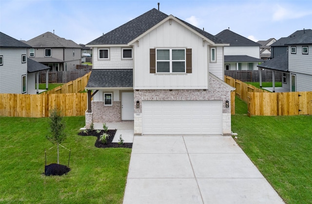 view of front facade with a garage and a front yard