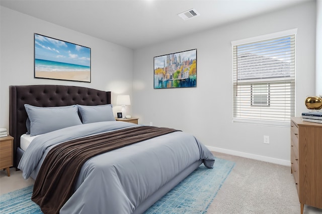 bedroom featuring light carpet