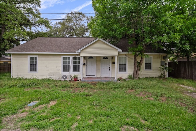 single story home featuring a front yard