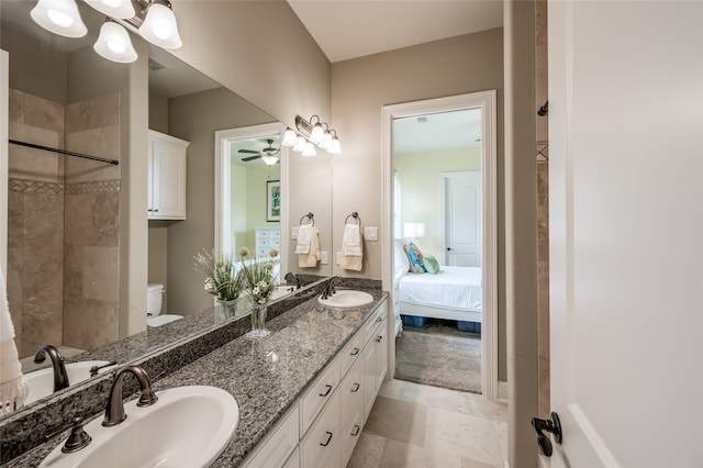 bathroom with ceiling fan, toilet, and vanity