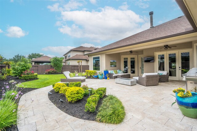 view of patio featuring outdoor lounge area, french doors, and ceiling fan