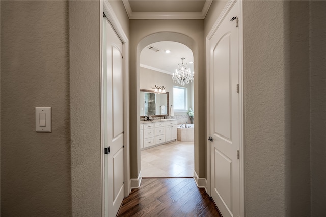 corridor featuring hardwood / wood-style flooring and crown molding