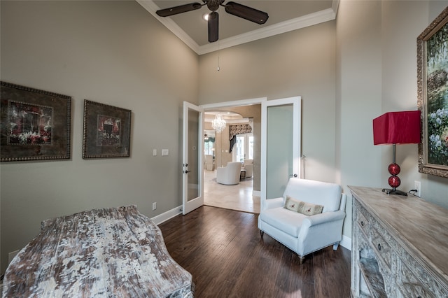 bedroom with french doors, a towering ceiling, ceiling fan, crown molding, and dark wood-type flooring