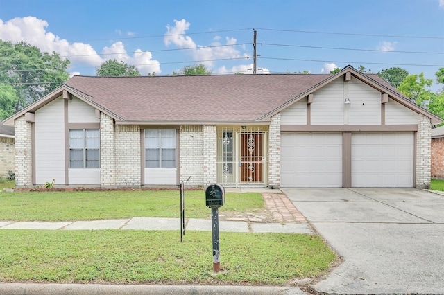 single story home featuring a garage and a front yard