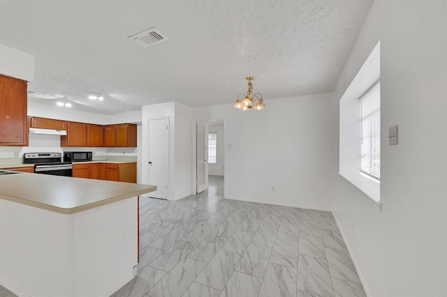 kitchen featuring pendant lighting, stainless steel electric range, a textured ceiling, a notable chandelier, and light tile floors