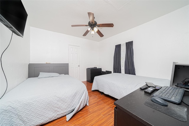 bedroom featuring light hardwood / wood-style flooring and ceiling fan